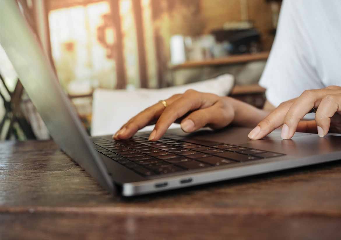 hands-using-laptop_390x275@3x