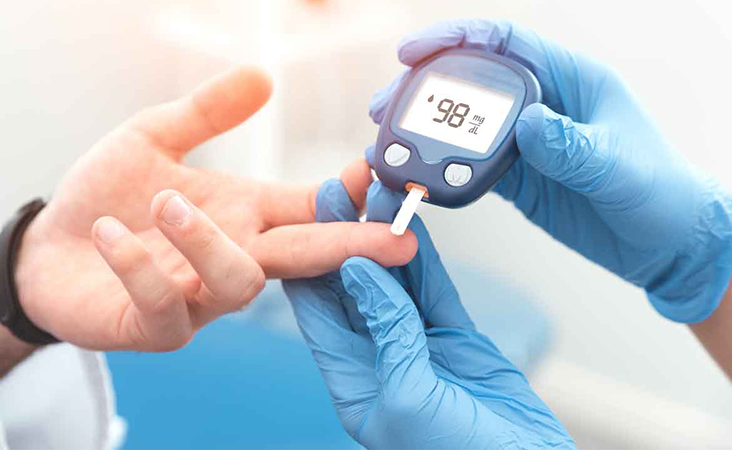 Doctor testing patient for diabetes