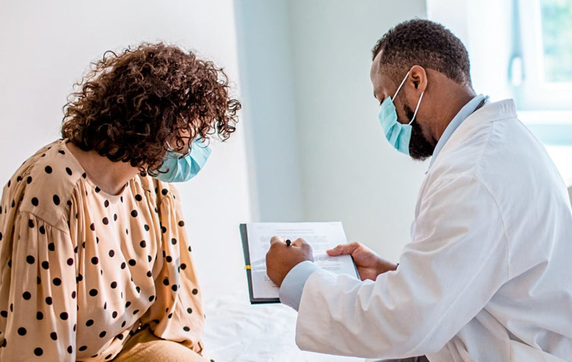Doctor showing patient a document