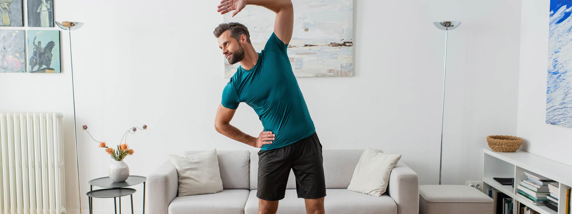 Man-practicing-yoga-routine-at-home