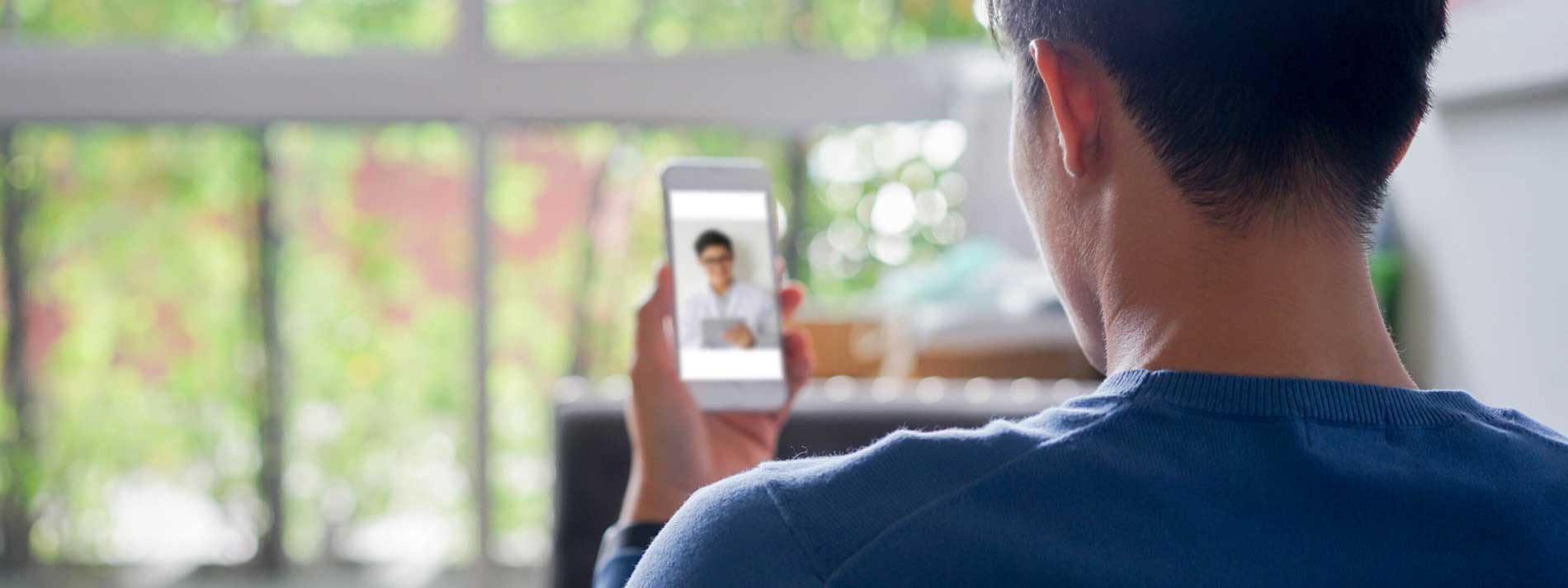 Man receiving telehealth video call