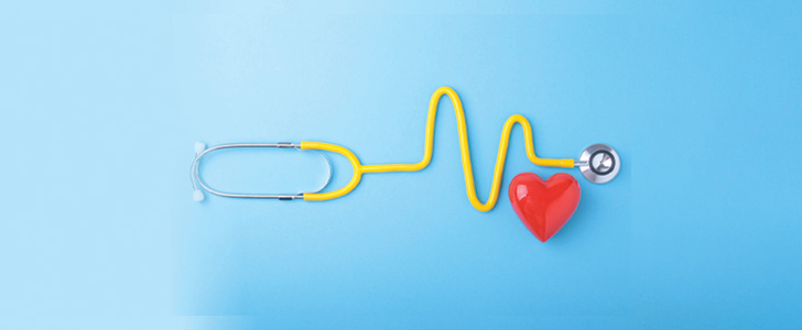Doctor's stethoscope next to red heart